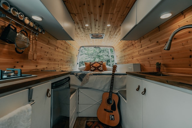 An RV showcasing compact living and featuring a guitar.